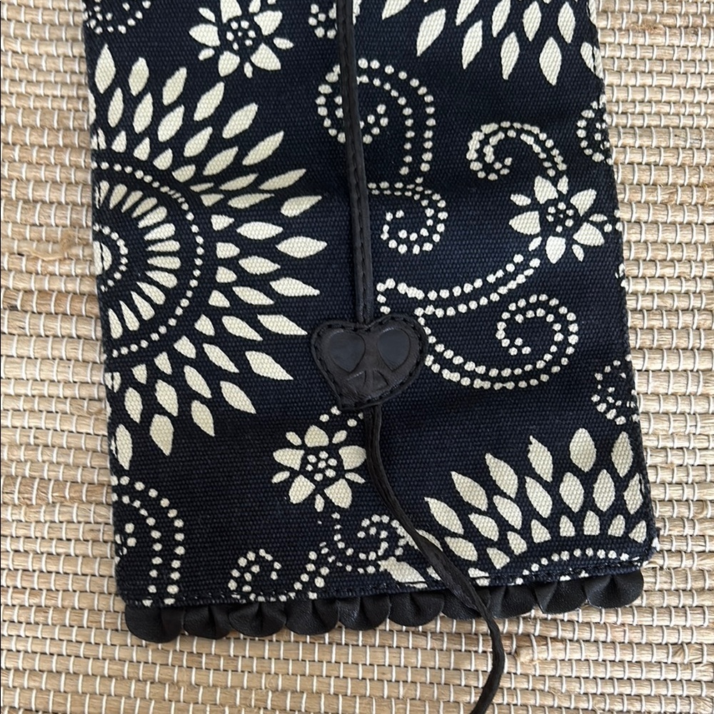 Lucky Brand Black and Cream Floral Accessory Travel Pouch with leather trim.